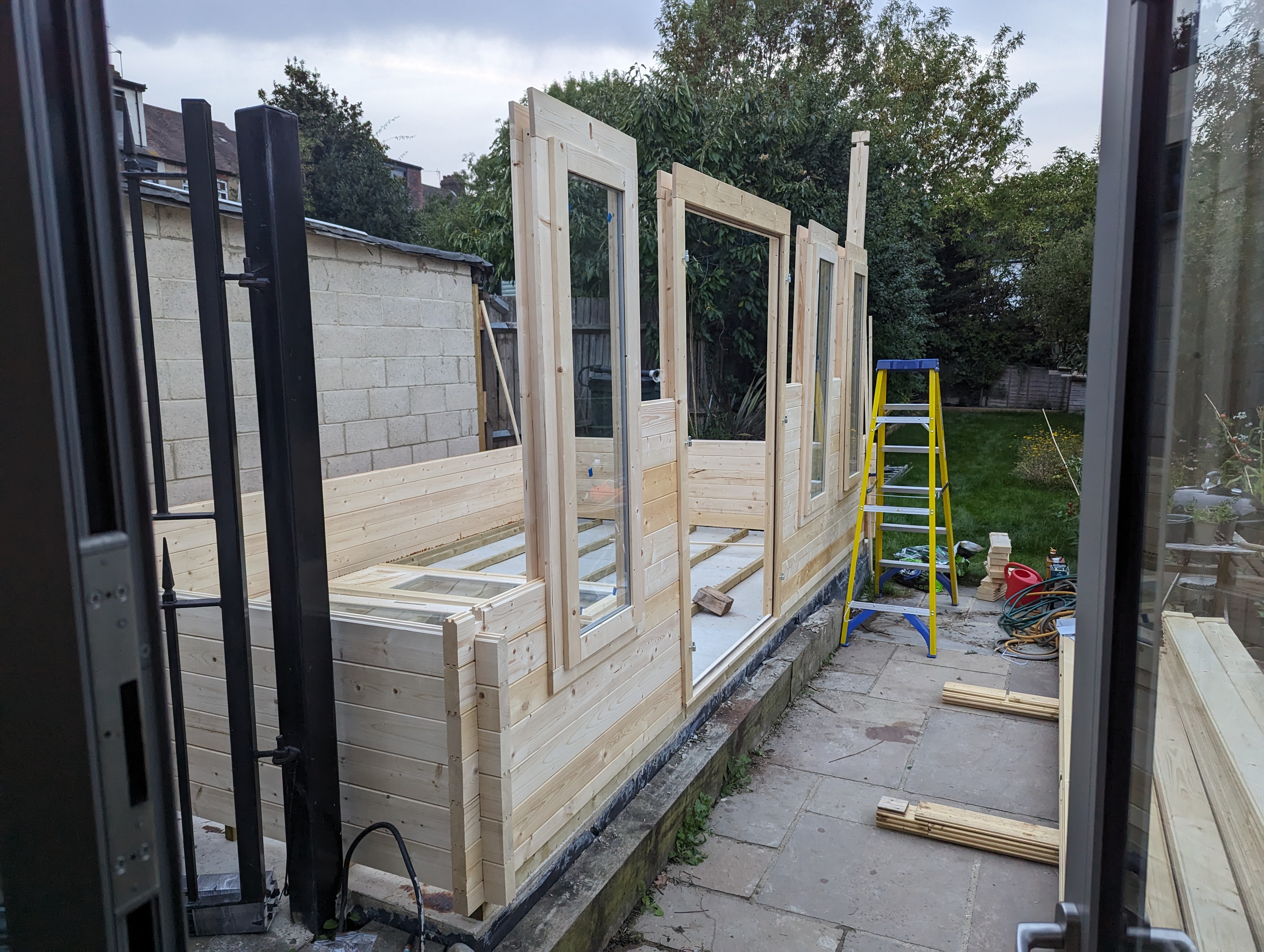 Slotting the window and door frames in.
